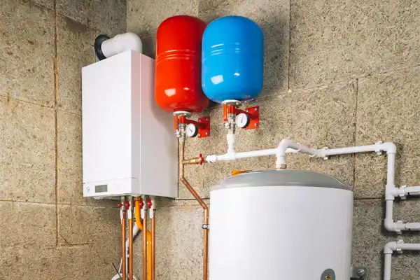 A tanked and tankless water heater in a [primary_location] home.