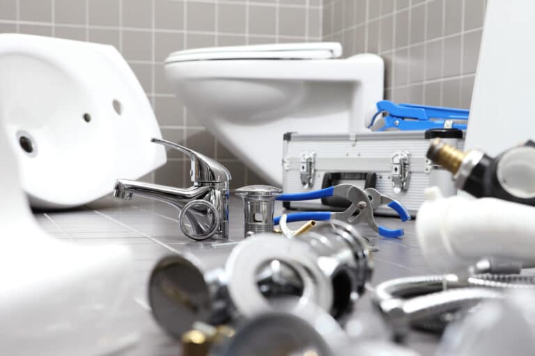 bathroom scene in the middle of a plumbing repair